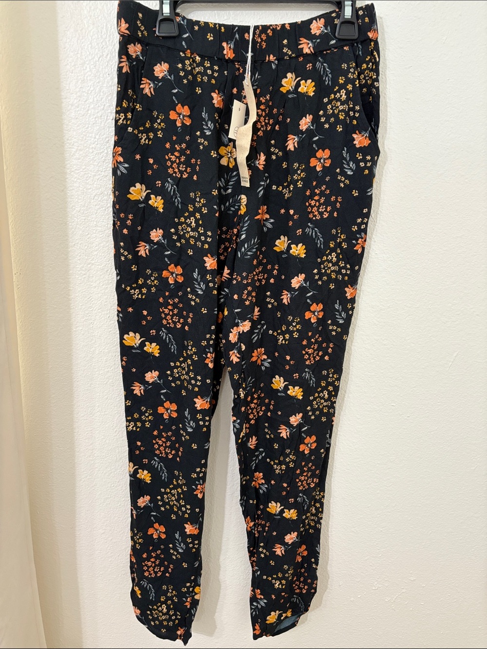 saltwater LUXE Black Jogger Pants with Orange & Yellow Floral Print
